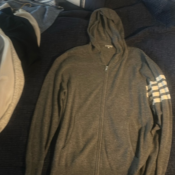Barely worn zip up grey hoodie with white varsity stripes. Awesome piece. - Picture 1 of 3